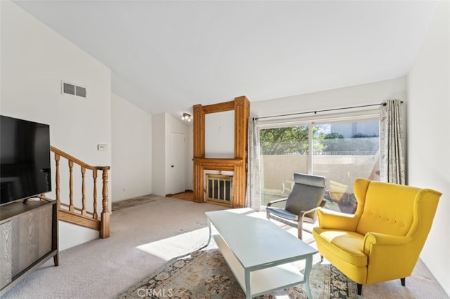 living room featuring light carpet and high vaulted ceiling