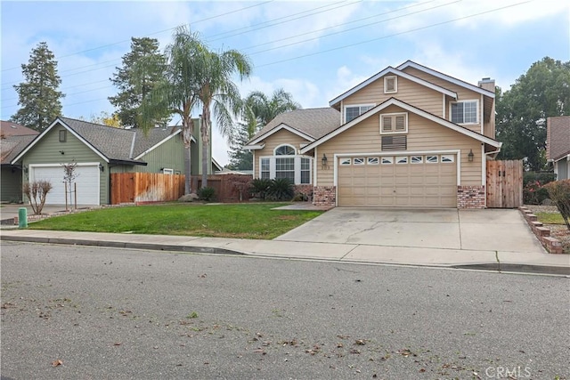 view of front facade with a front yard and a garage