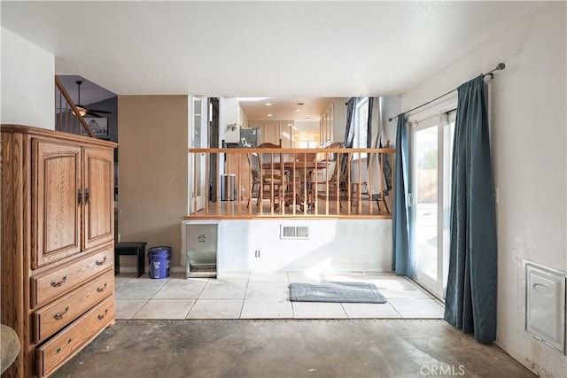 interior space featuring ceiling fan