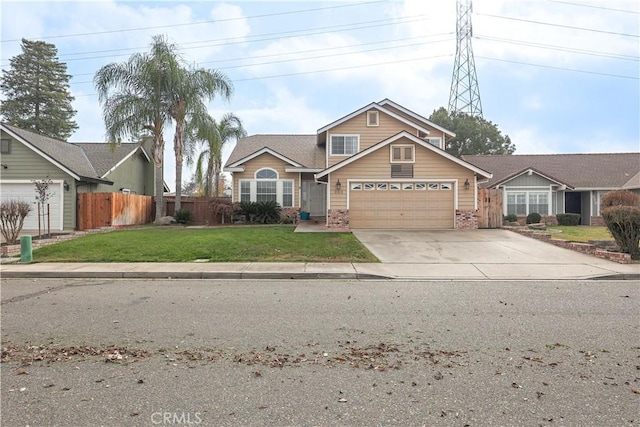 view of front of property with a garage and a front lawn