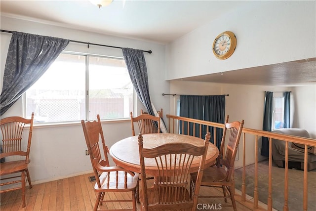 dining space featuring hardwood / wood-style flooring