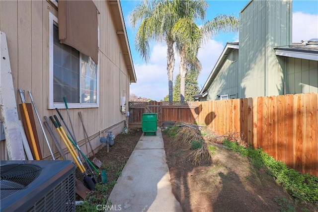 view of side of home featuring central AC unit