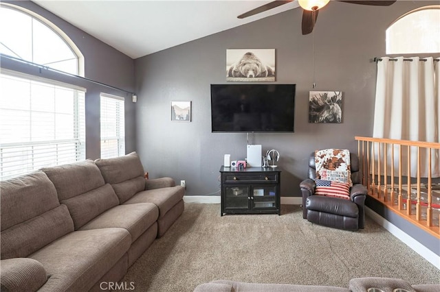 carpeted living room featuring ceiling fan and vaulted ceiling