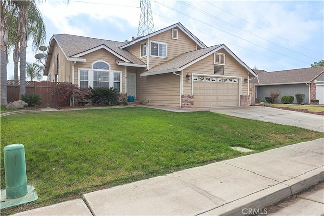 view of front of property featuring a garage and a front yard