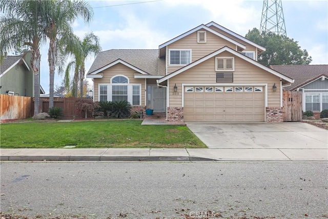 view of front of house with a garage and a front lawn