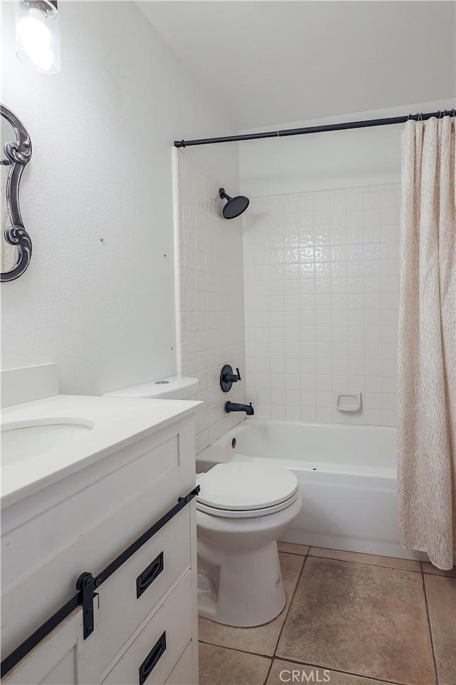 full bathroom featuring tile patterned floors, vanity, toilet, and shower / tub combo with curtain