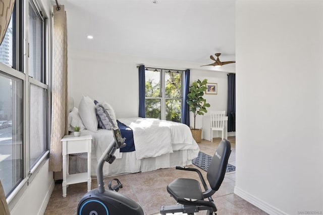 tiled bedroom with ceiling fan