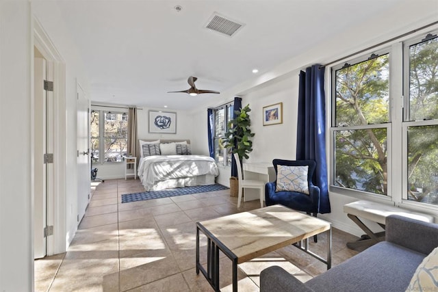 bedroom featuring ceiling fan and light tile patterned flooring