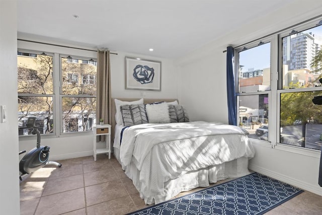 tiled bedroom with multiple windows