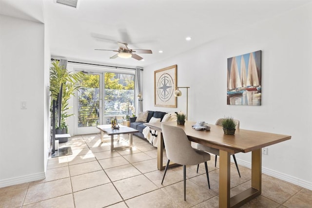 dining area featuring light tile patterned floors and ceiling fan