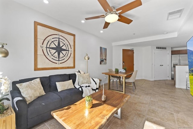 living room featuring ceiling fan