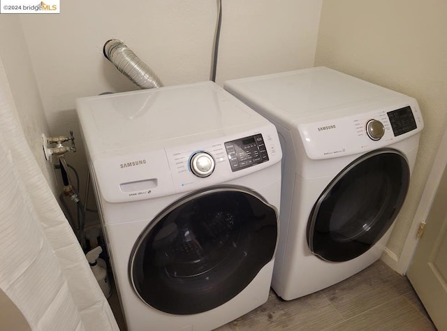 laundry room with washing machine and clothes dryer