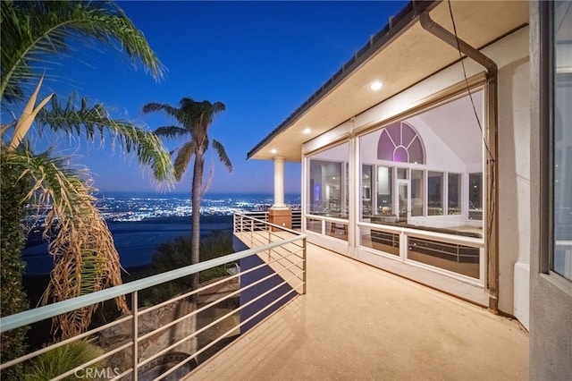 view of balcony at dusk