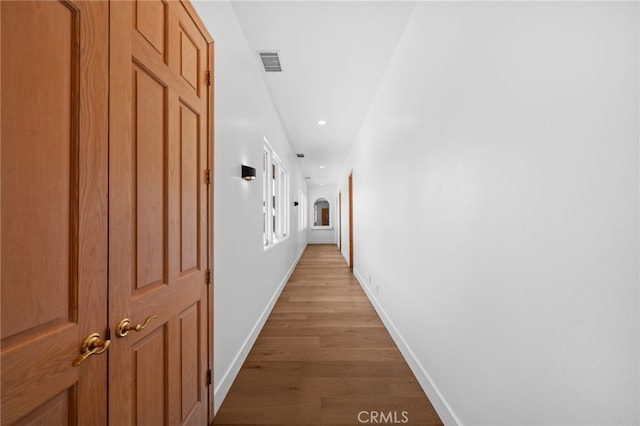 corridor featuring light hardwood / wood-style flooring