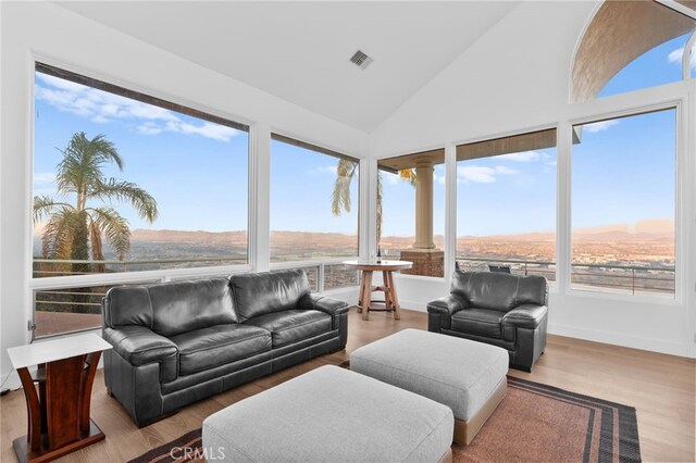 sunroom featuring vaulted ceiling