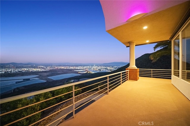 view of balcony at dusk