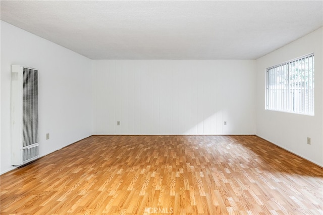 unfurnished room with light hardwood / wood-style floors