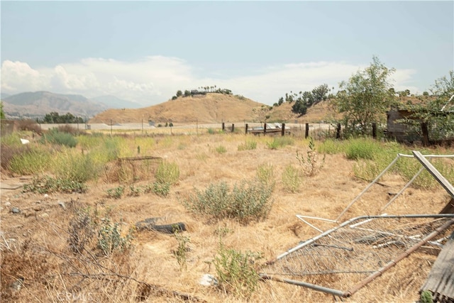 view of mountain feature with a rural view