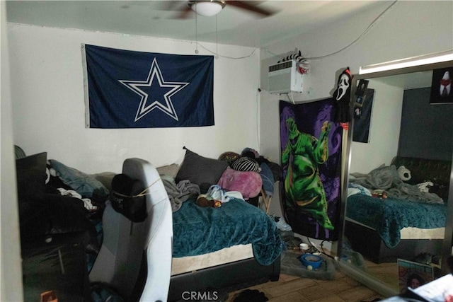 bedroom featuring hardwood / wood-style floors and ceiling fan