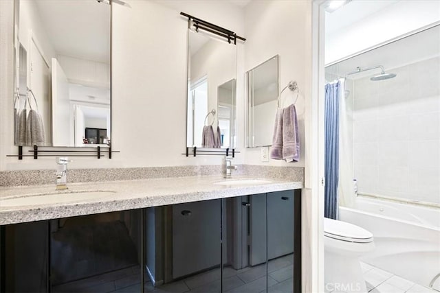 full bathroom with tile patterned flooring, vanity, shower / tub combo, and toilet