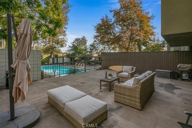 view of patio featuring a fenced in pool