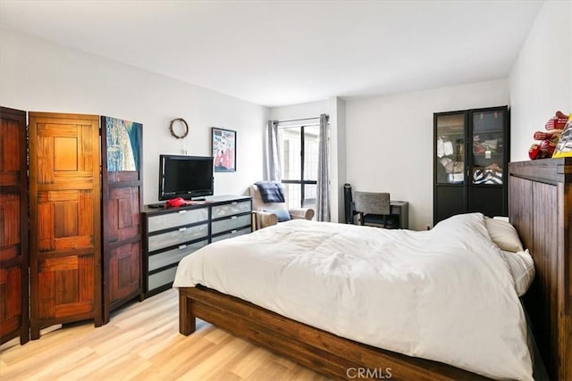 bedroom featuring light wood-type flooring