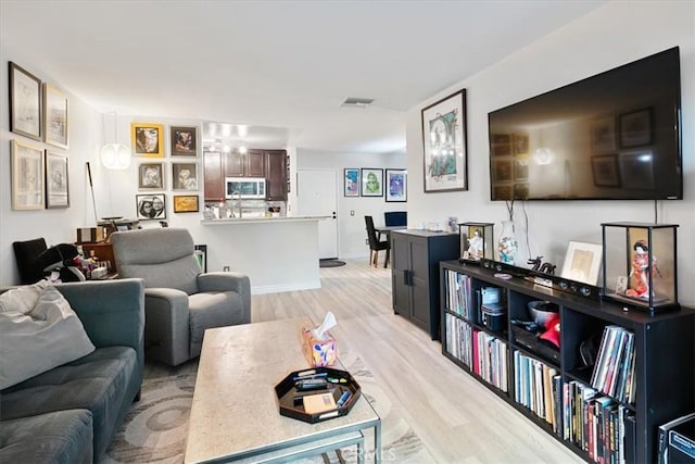 living room with light hardwood / wood-style flooring