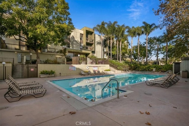 view of pool featuring a patio