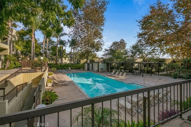 view of pool featuring a patio area