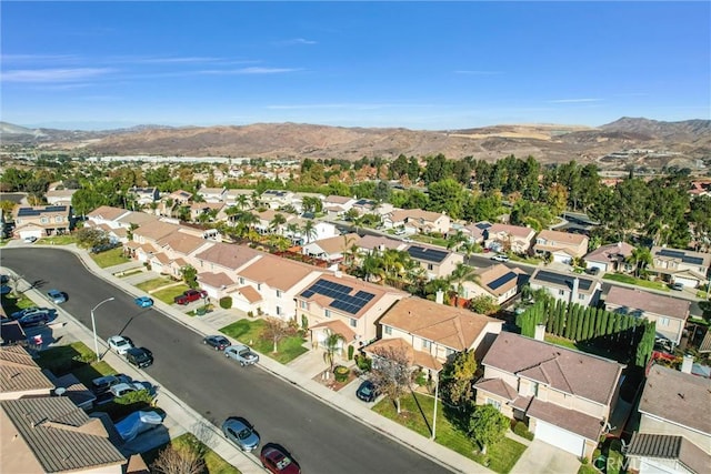 birds eye view of property with a mountain view