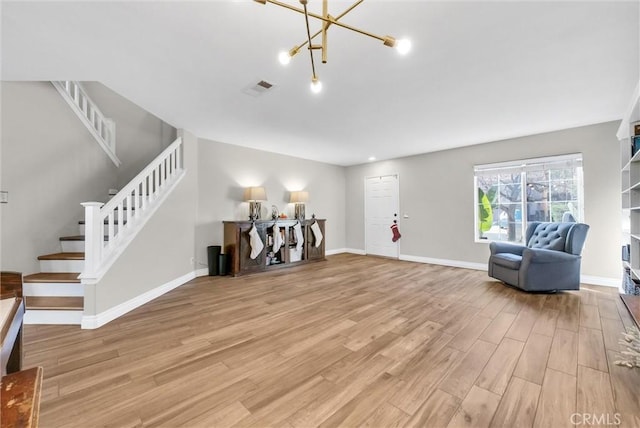 interior space featuring light hardwood / wood-style flooring and an inviting chandelier