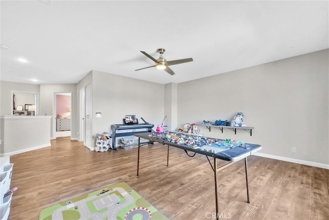 recreation room featuring ceiling fan and wood-type flooring