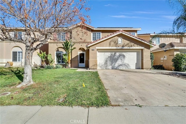 view of front of house with a garage and a front lawn