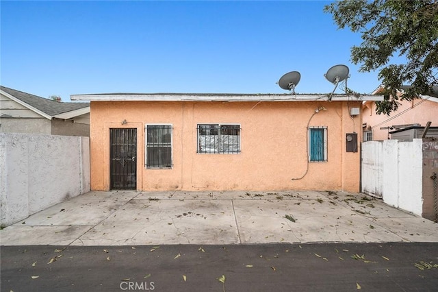 rear view of property featuring a patio area