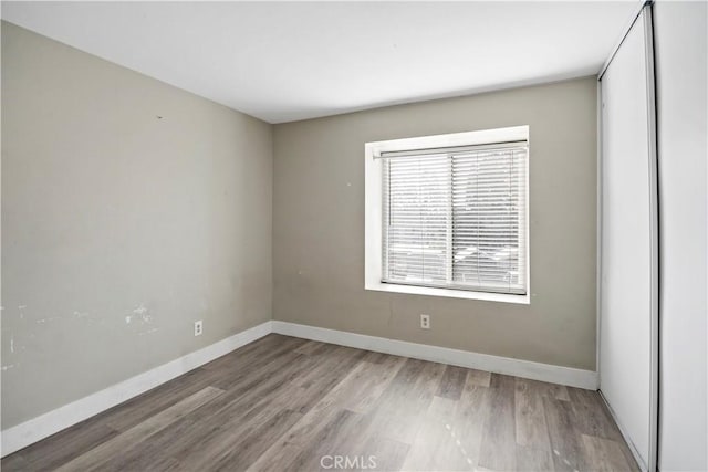 spare room featuring hardwood / wood-style floors