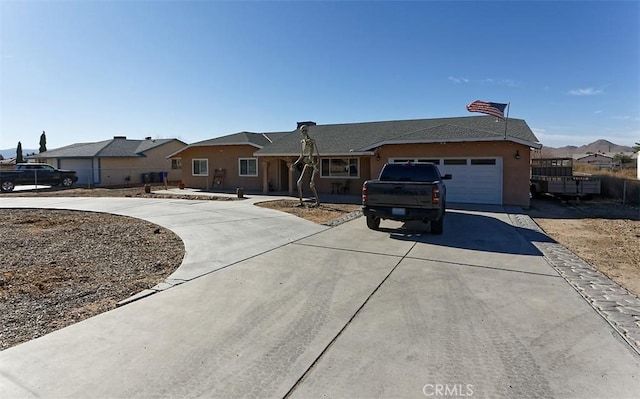 ranch-style house featuring a garage