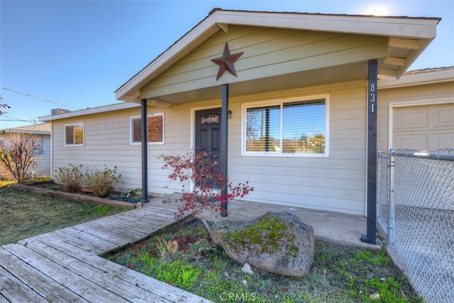 view of front of house featuring covered porch and a garage