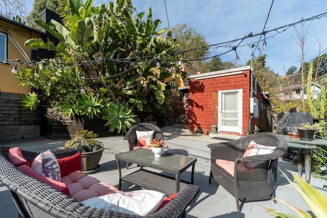 view of patio / terrace featuring a storage shed, an outdoor hangout area, and area for grilling