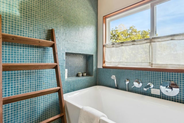 bathroom with a tub to relax in