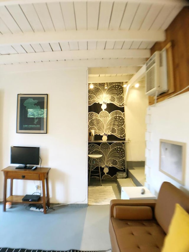 interior space featuring wooden ceiling, an AC wall unit, and beamed ceiling