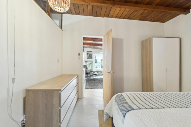 bedroom with lofted ceiling with beams and wood ceiling