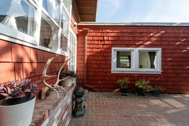 view of property exterior featuring a patio area