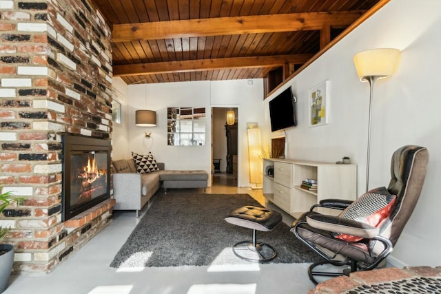 living room with wood ceiling, concrete flooring, beamed ceiling, and a fireplace