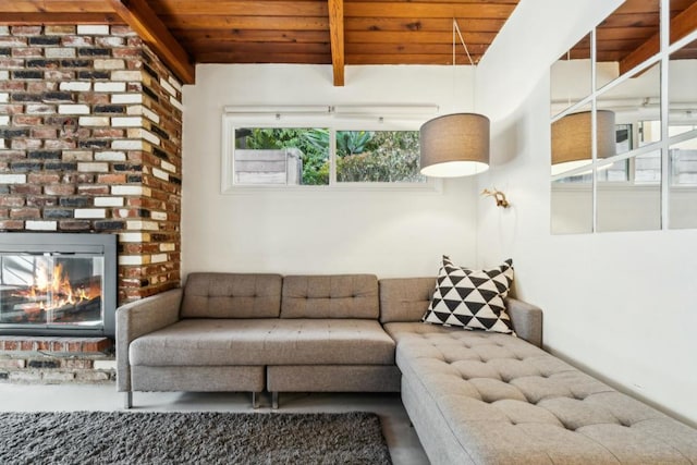 living room featuring wood ceiling, a fireplace, and beamed ceiling