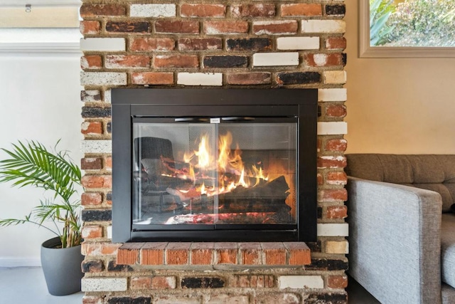 details featuring a brick fireplace