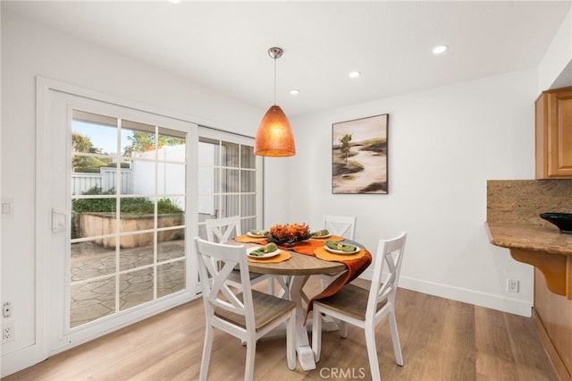 dining room with light wood-type flooring