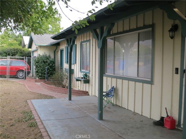 view of side of home with a patio area