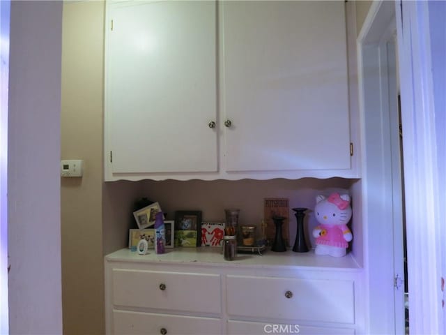 kitchen featuring white cabinetry