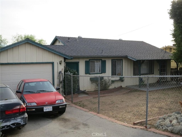 ranch-style home featuring a garage