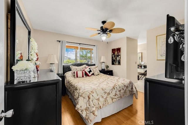 bedroom featuring hardwood / wood-style floors and ceiling fan